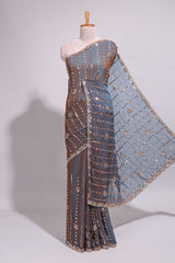 Steel blue saree with silver sequin floral motifs vertical stripe detailing and an embellished border along with blouse