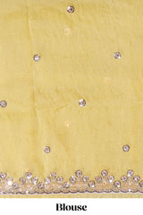 Lemon yellow saree with silver sequin abstract embroidery floral motifs and a shimmering embellished border along with matching blouse
