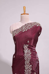 Deep wine saree with elegant golden floral embroidery and a rich embellished border along with matching blouse
