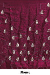 Deep wine saree with elegant golden floral embroidery and a rich embellished border along with matching blouse