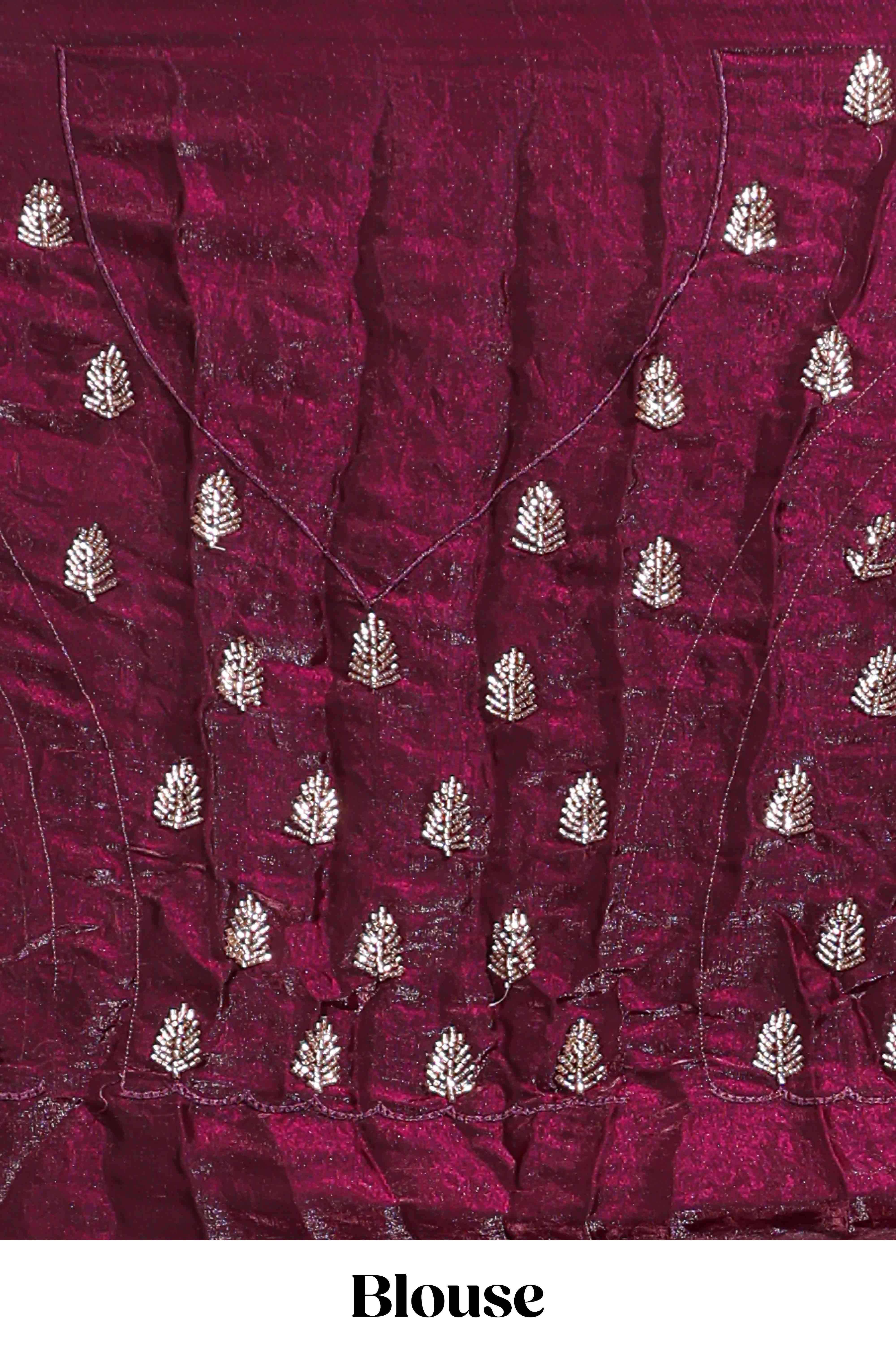 Deep wine saree with elegant golden floral embroidery and a rich embellished border along with matching blouse