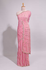 Baby pink saree with silver sequin wavy line embroidery floral motifs and a sparkling embellished border along with matching blouse