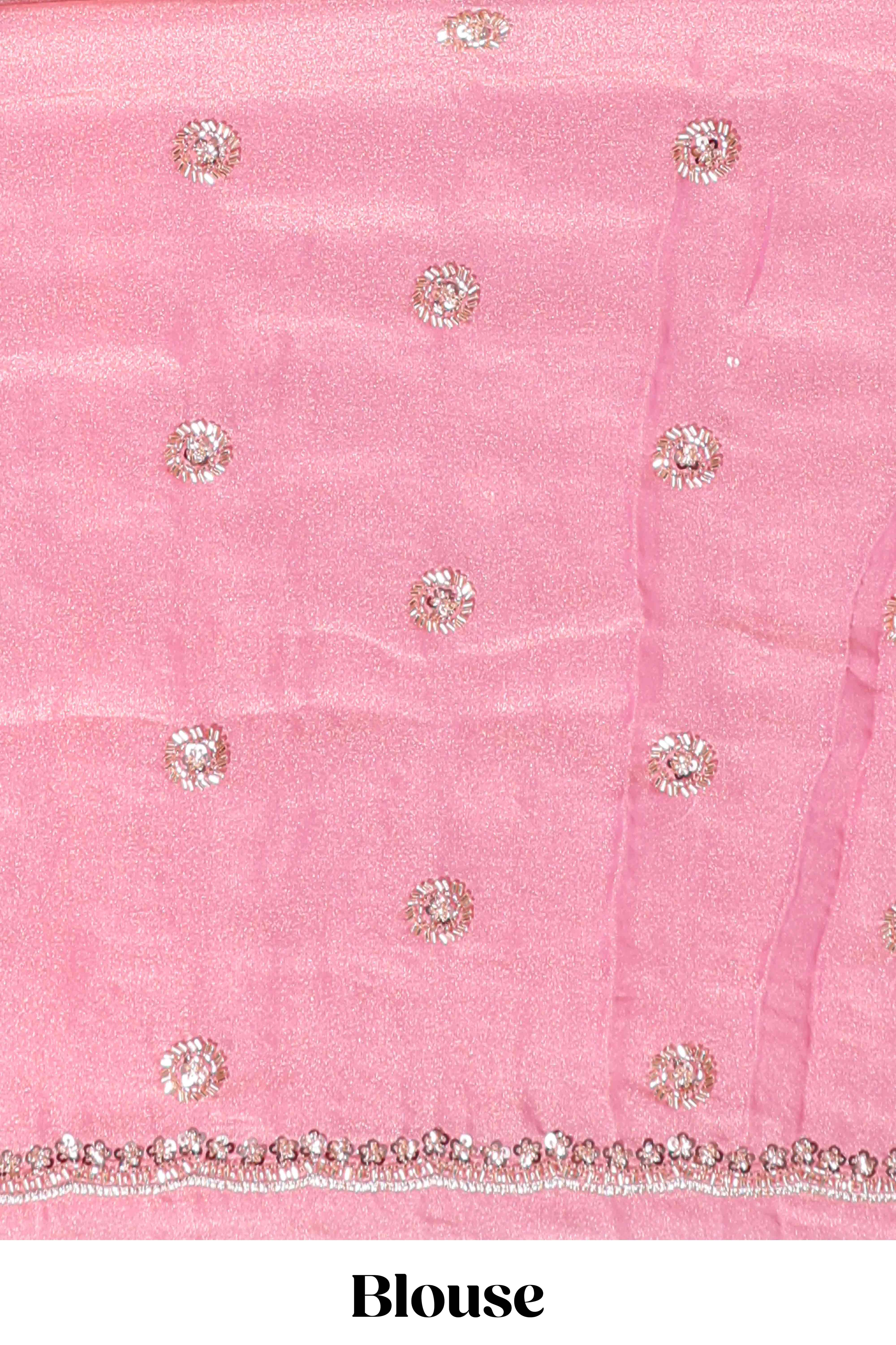 Baby pink saree with silver sequin wavy line embroidery floral motifs and a sparkling embellished border along with matching blouse