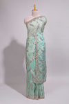 Mint green saree with silver sequin abstract wave embroidery and a detailed embellished border along with work blouse