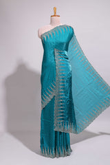 Teal blue saree with sequin striped embroidery scattered butti detailing and embellished border along with matching blouse