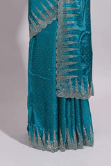 Teal blue saree with sequin striped embroidery scattered butti detailing and embellished border along with matching blouse