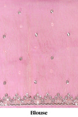 Dusty pink saree with sequin abstract wave embroidery and a detailed embellished border along with matching blouse