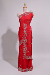 Bright red saree with elegant golden floral embroidery and a rich embellished border along with matching blouse