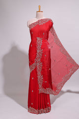 Bright red saree with elegant golden floral embroidery and a rich embellished border along with matching blouse