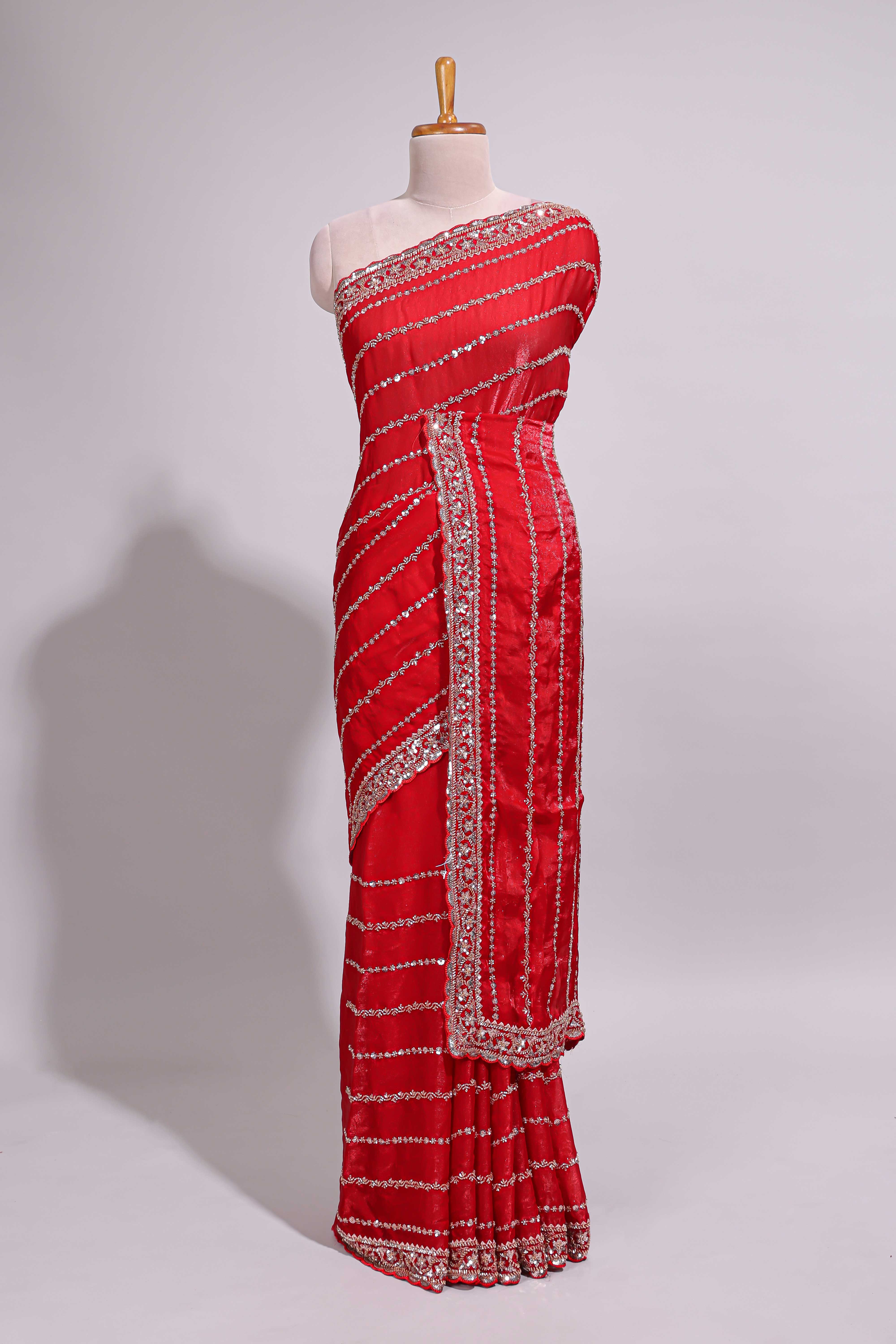 Red saree with silver sequin stripes embellished border and matching designer pallu along with blouse