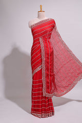 Red saree with silver sequin stripes embellished border and matching designer pallu along with blouse