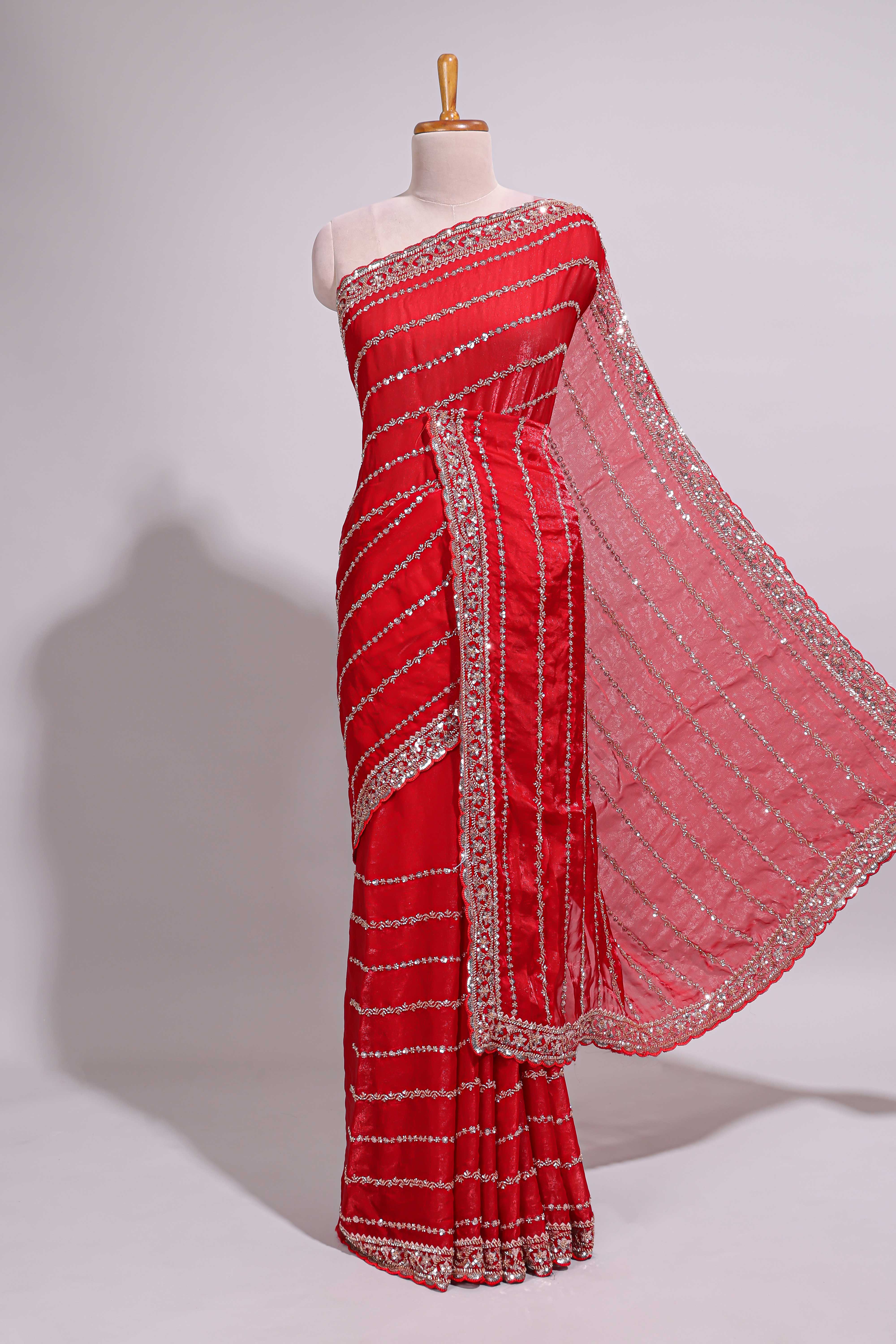 Red saree with silver sequin stripes embellished border and matching designer pallu along with blouse