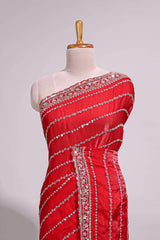 Red saree with silver sequin stripes embellished border and matching designer pallu along with blouse