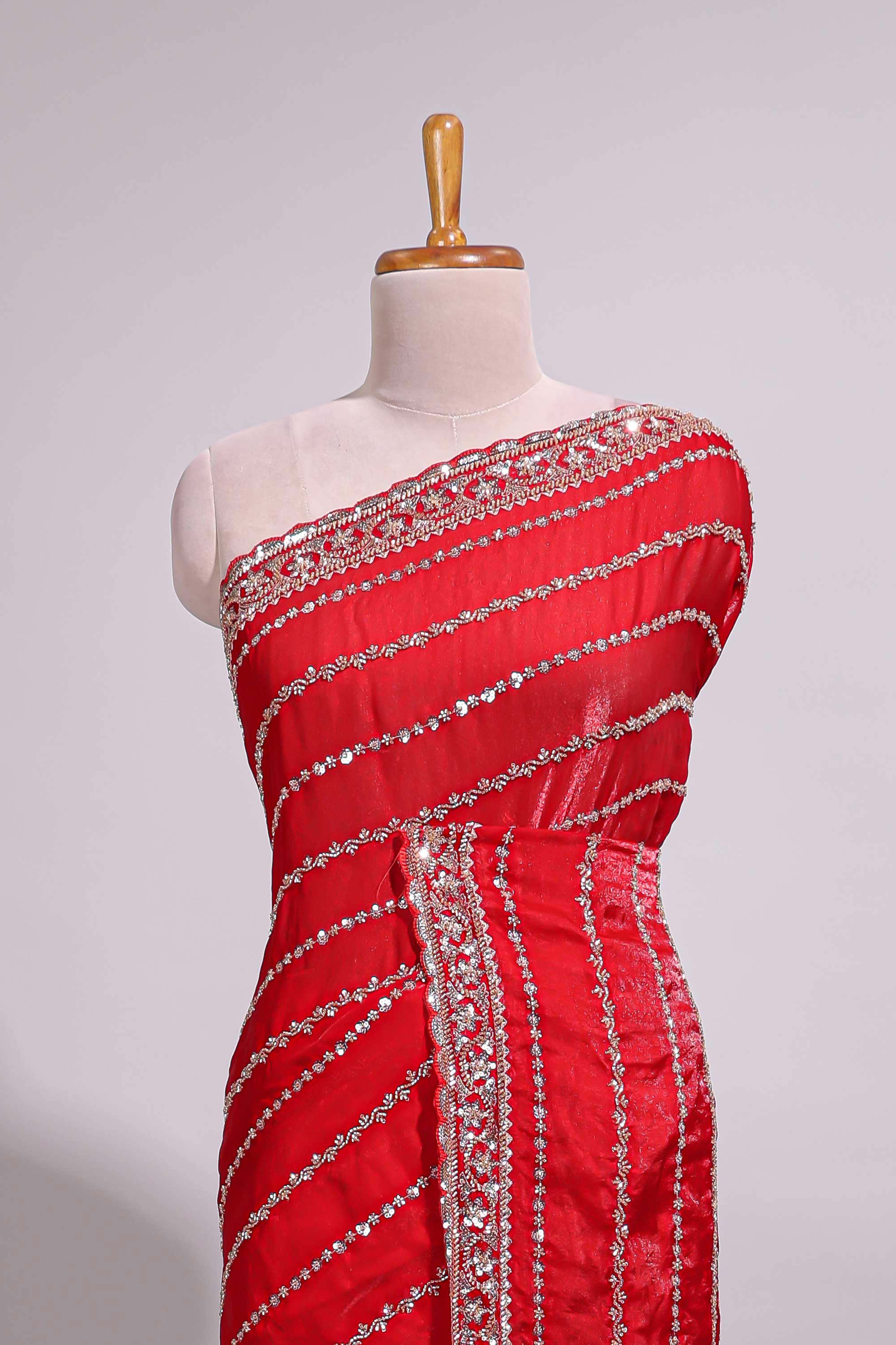 Red saree with silver sequin stripes embellished border and matching designer pallu along with blouse