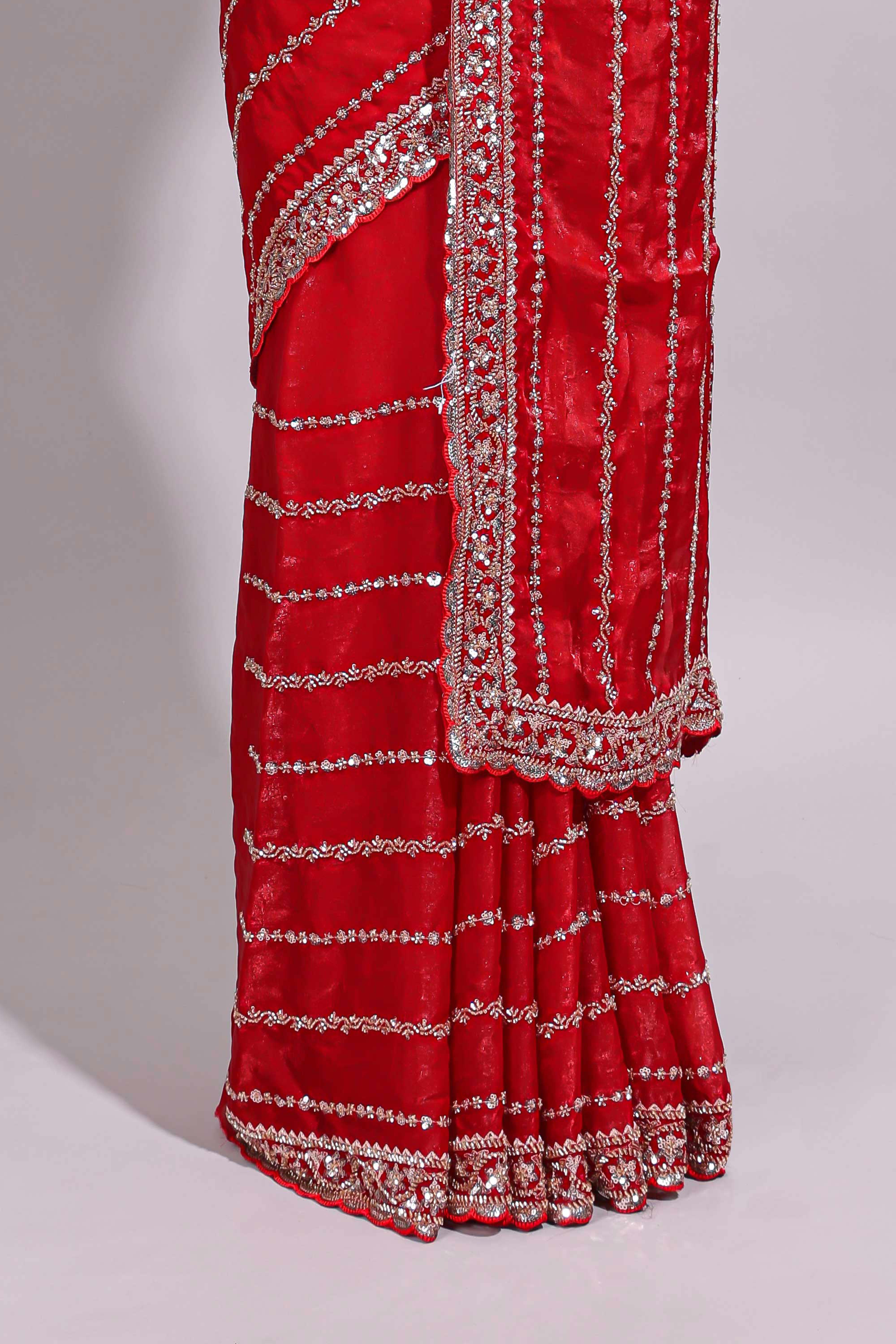 Red saree with silver sequin stripes embellished border and matching designer pallu along with blouse