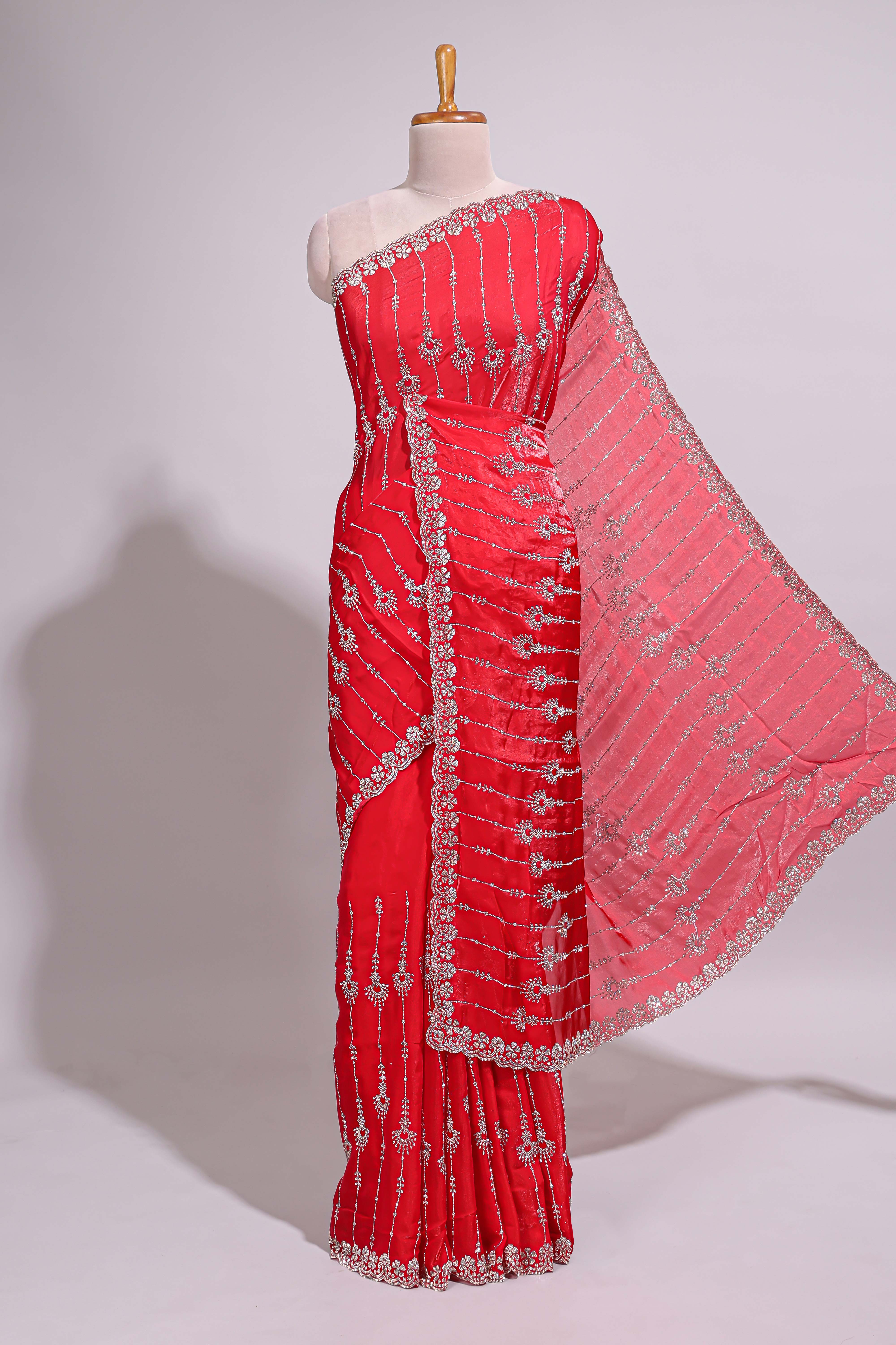 Red saree with silver vertical sequin lines floral motifs embellished border and matching pallu detailing along with matching blouse