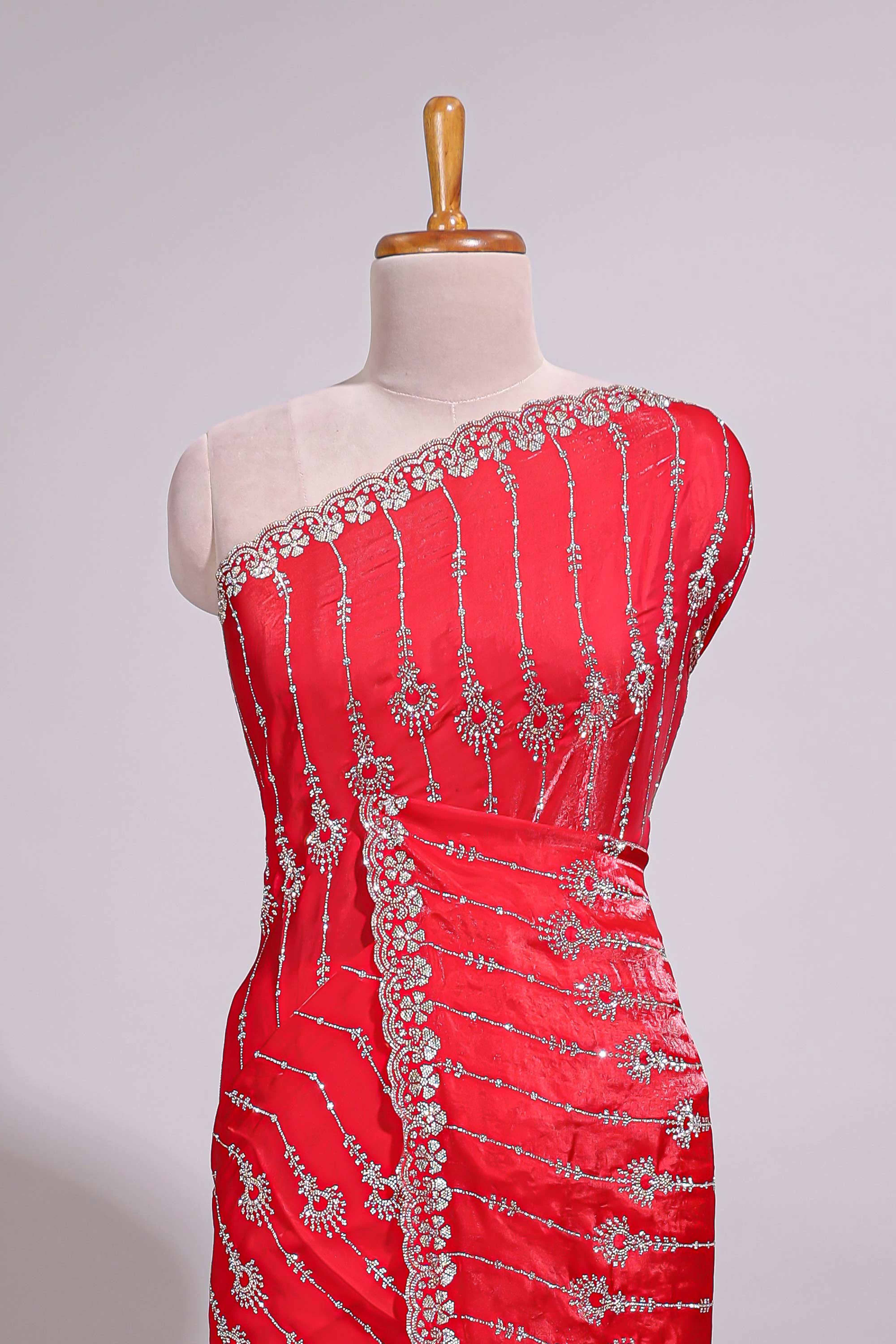 Red saree with silver vertical sequin lines floral motifs embellished border and matching pallu detailing along with matching blouse