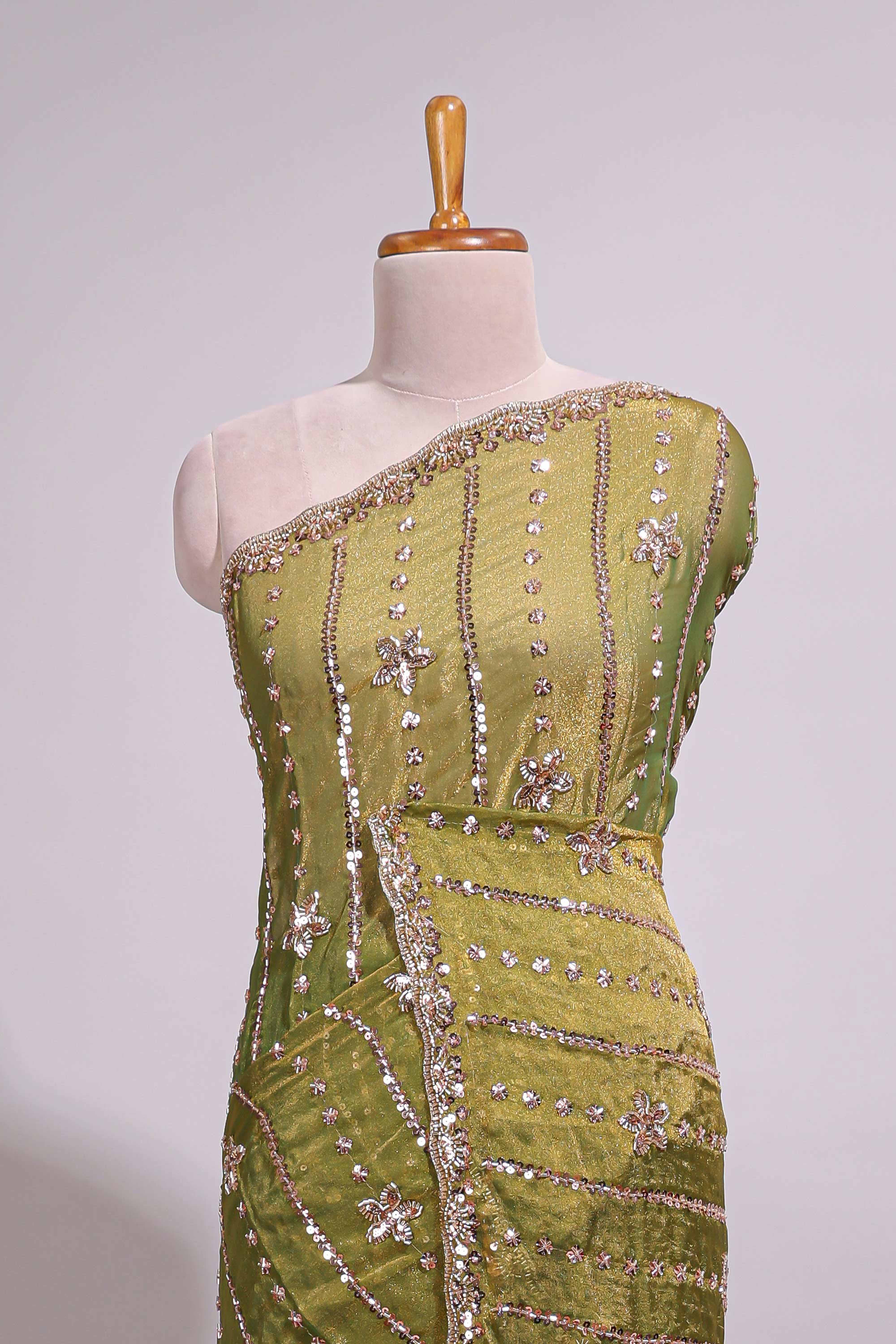 Olive green saree with silver sequin vertical lines floral motifs embellished border and matching pallu design along with matching blouse