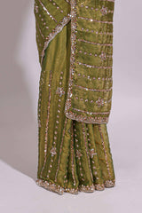 Olive green saree with silver sequin vertical lines floral motifs embellished border and matching pallu design along with matching blouse