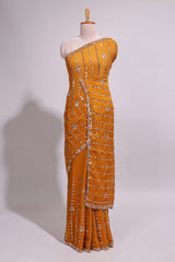 Mustard yellow saree with silver sequin vertical lines floral motifs embellished border and matching pallu design along with matching blouse