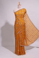 Mustard yellow saree with silver sequin vertical lines floral motifs embellished border and matching pallu design along with matching blouse