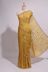 Turmeric yellow saree with silver sequin vertical lines floral motifs embellished border and matching pallu design along with matching blouse