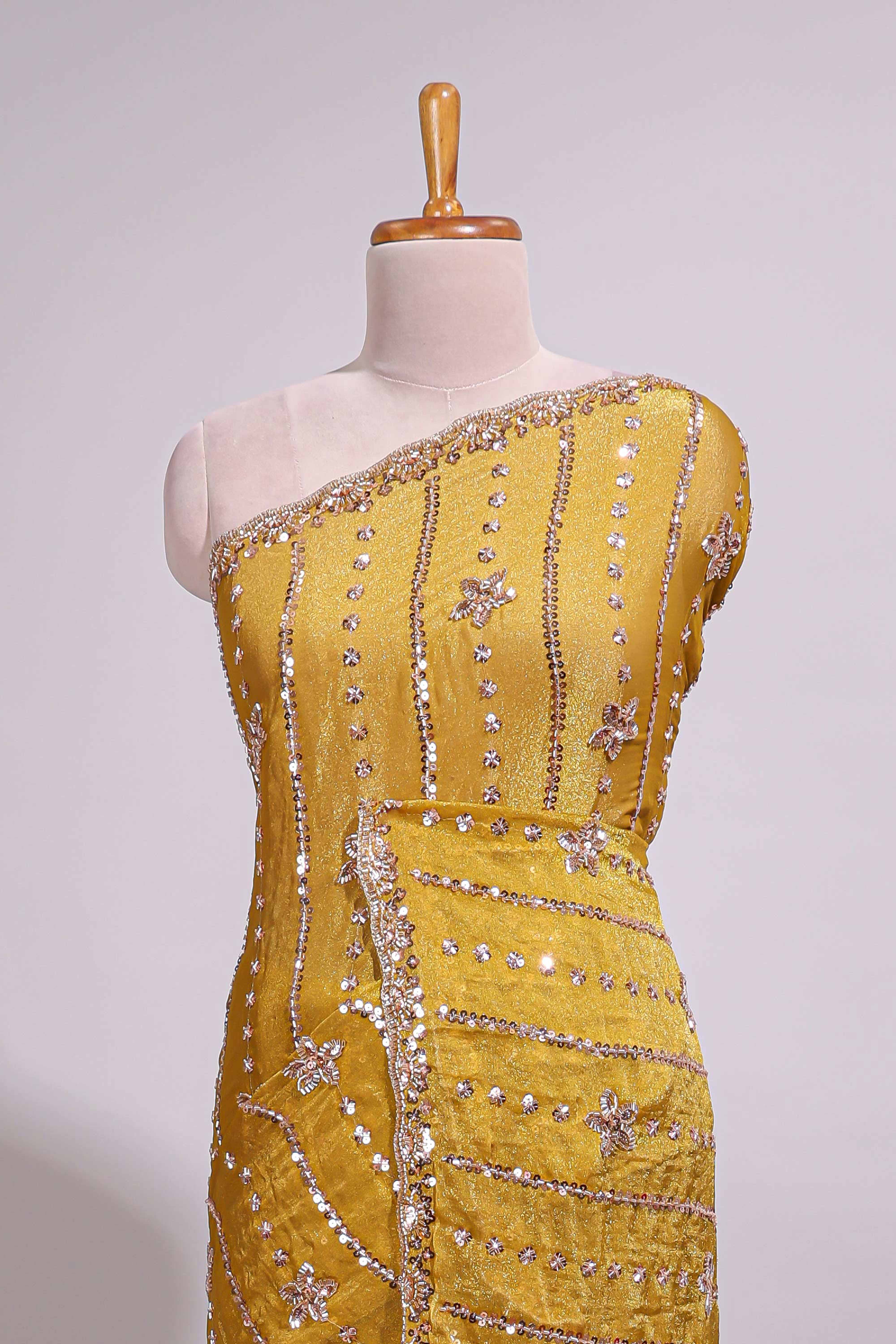 Turmeric yellow saree with silver sequin vertical lines floral motifs embellished border and matching pallu design along with matching blouse