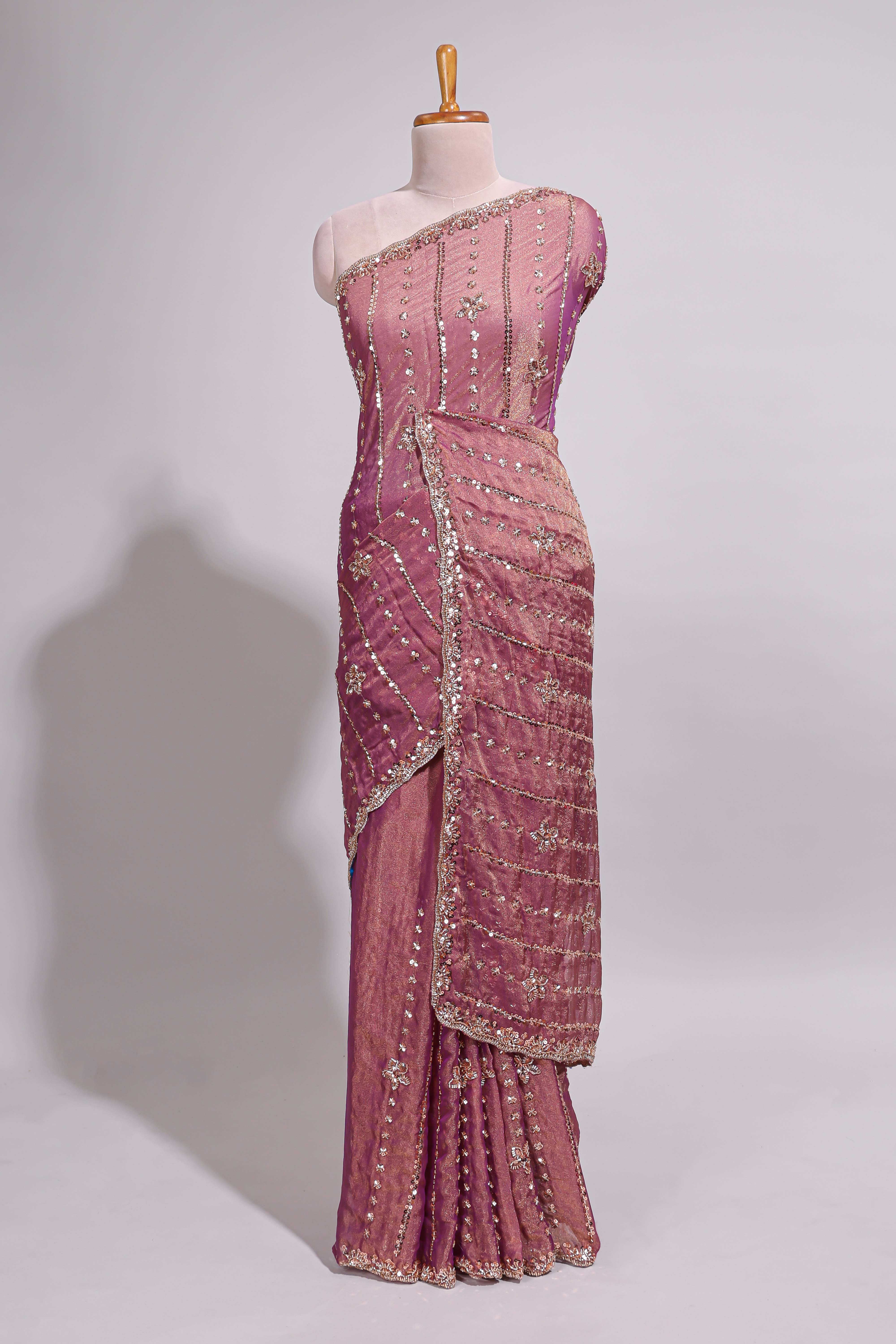 Onion pink saree with silver sequin vertical lines floral motifs embellished border and matching pallu design along with matching blouse