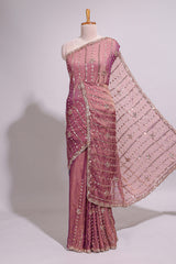 Onion pink saree with silver sequin vertical lines floral motifs embellished border and matching pallu design along with matching blouse