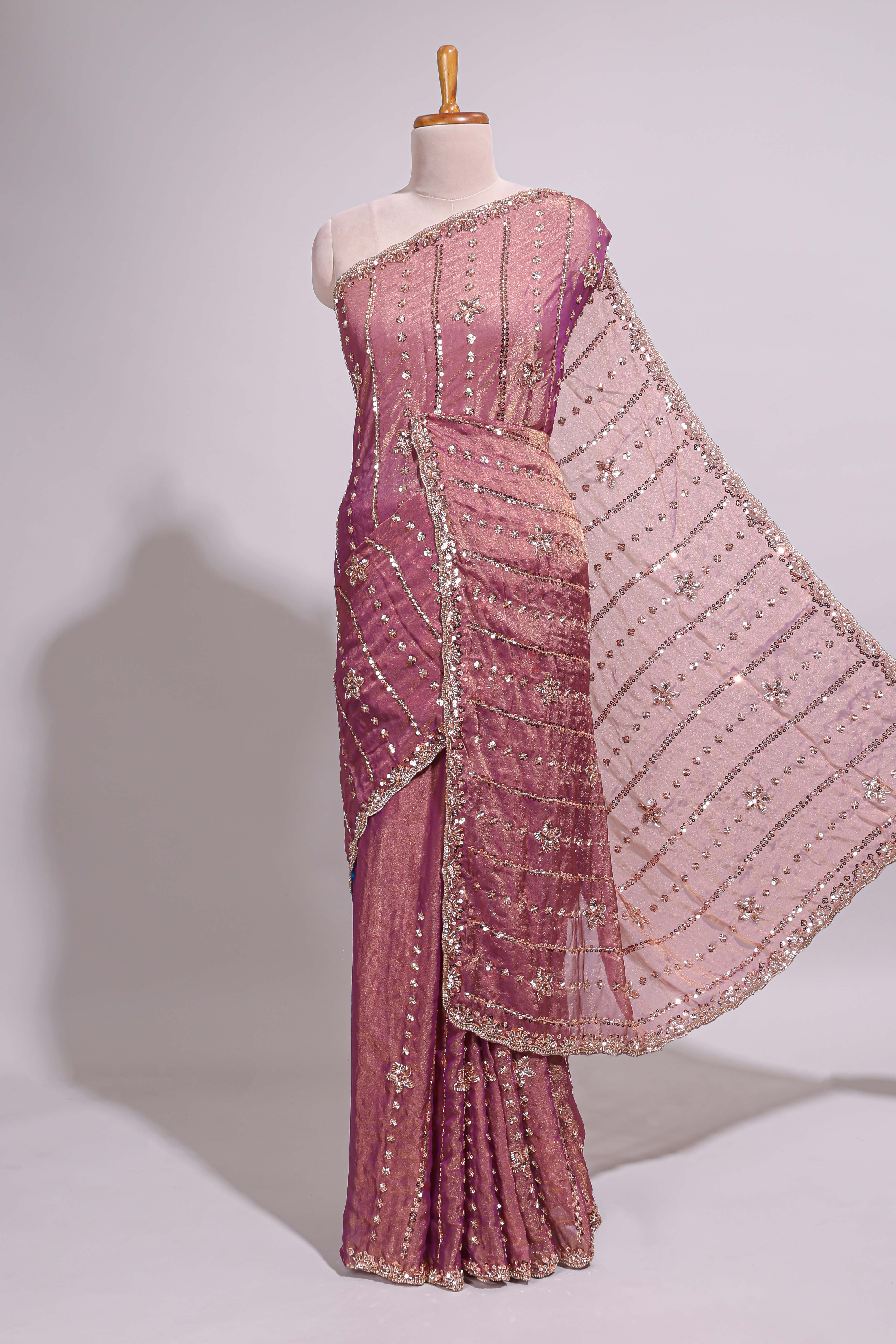 Onion pink saree with silver sequin vertical lines floral motifs embellished border and matching pallu design along with matching blouse