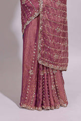 Onion pink saree with silver sequin vertical lines floral motifs embellished border and matching pallu design along with matching blouse