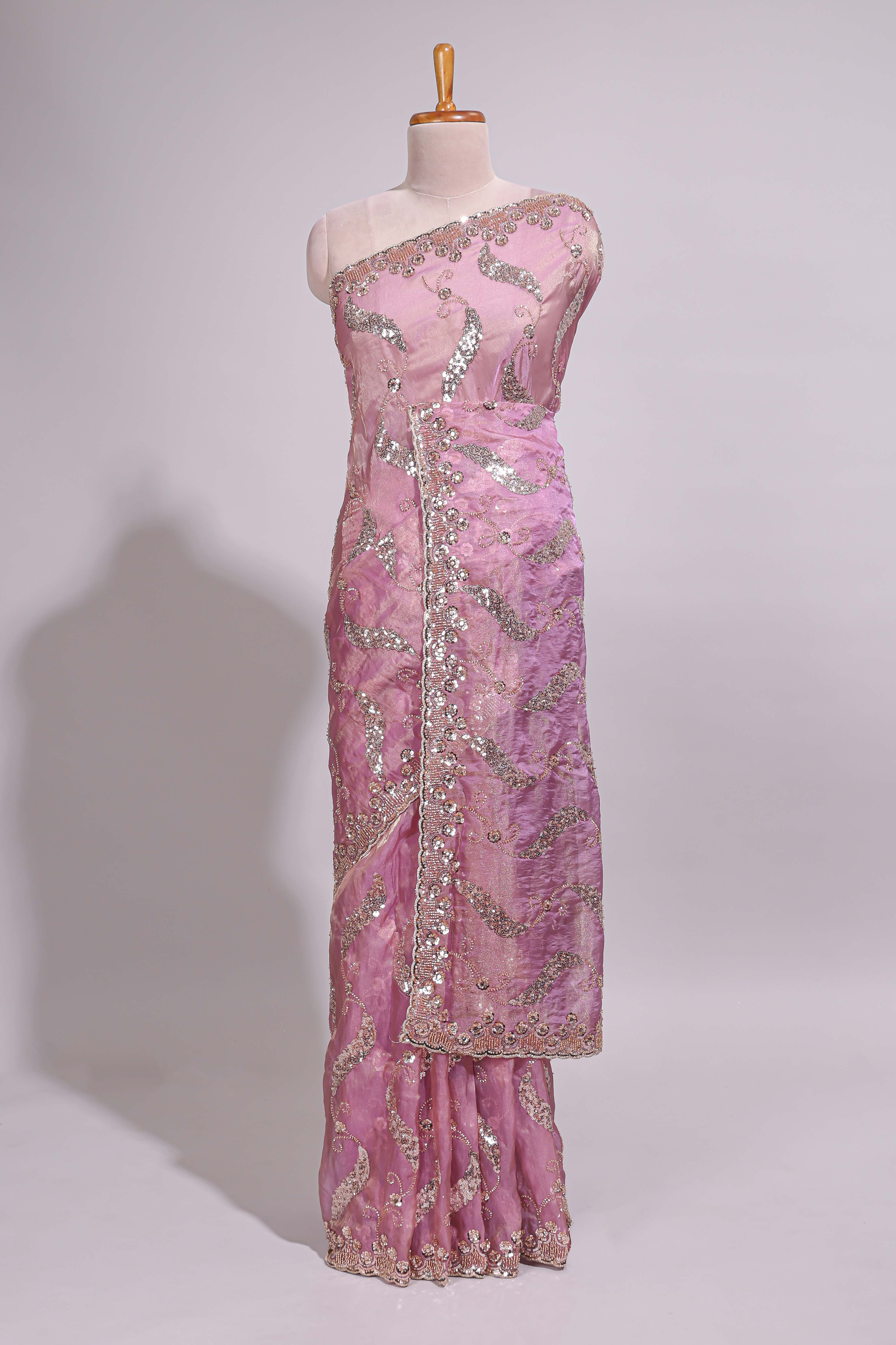 Onion pink saree with sequin abstract wave embroidery and a detailed embellished border along with matching blouse