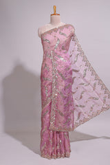 Onion pink saree with sequin abstract wave embroidery and a detailed embellished border along with matching blouse