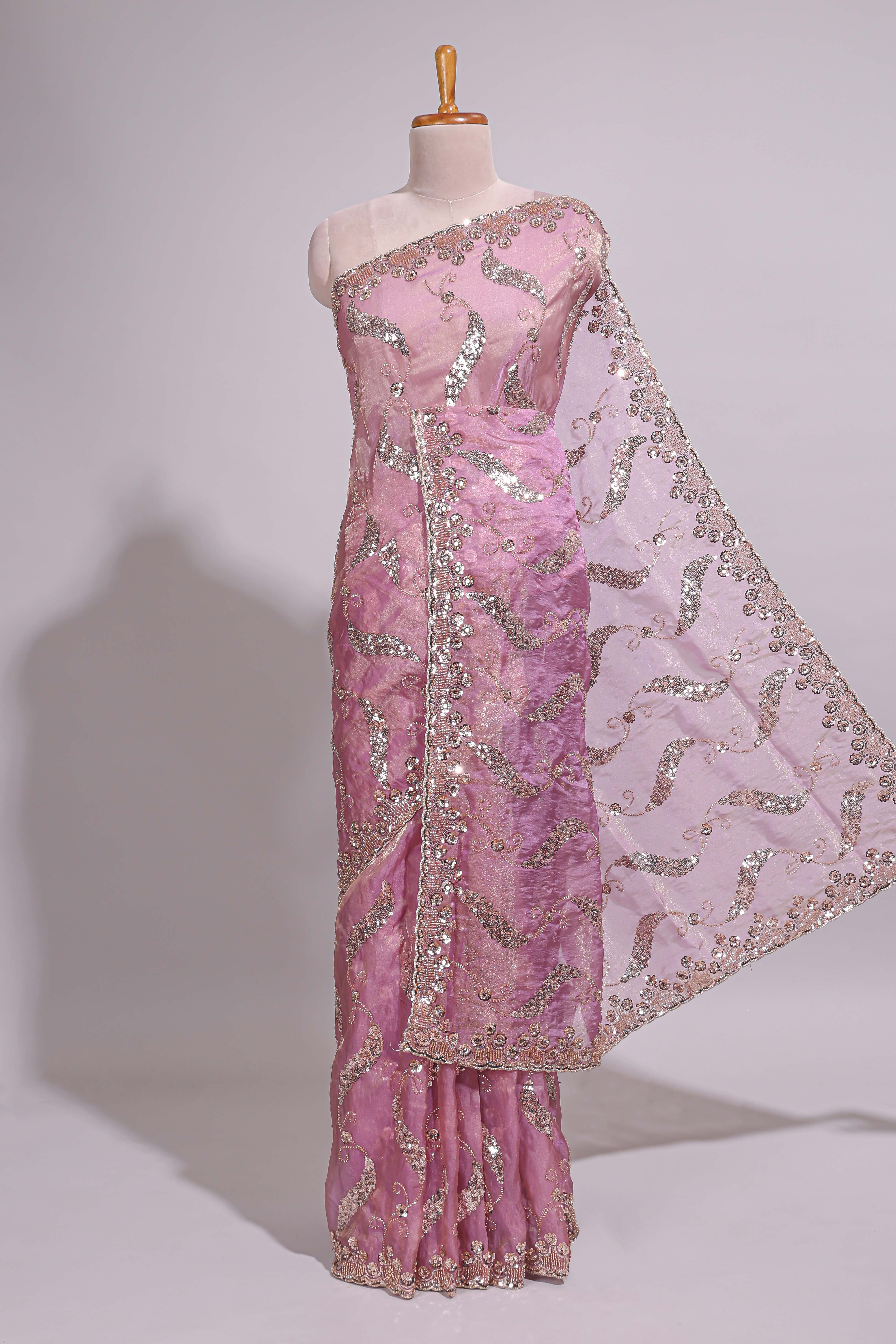 Onion pink saree with sequin abstract wave embroidery and a detailed embellished border along with matching blouse