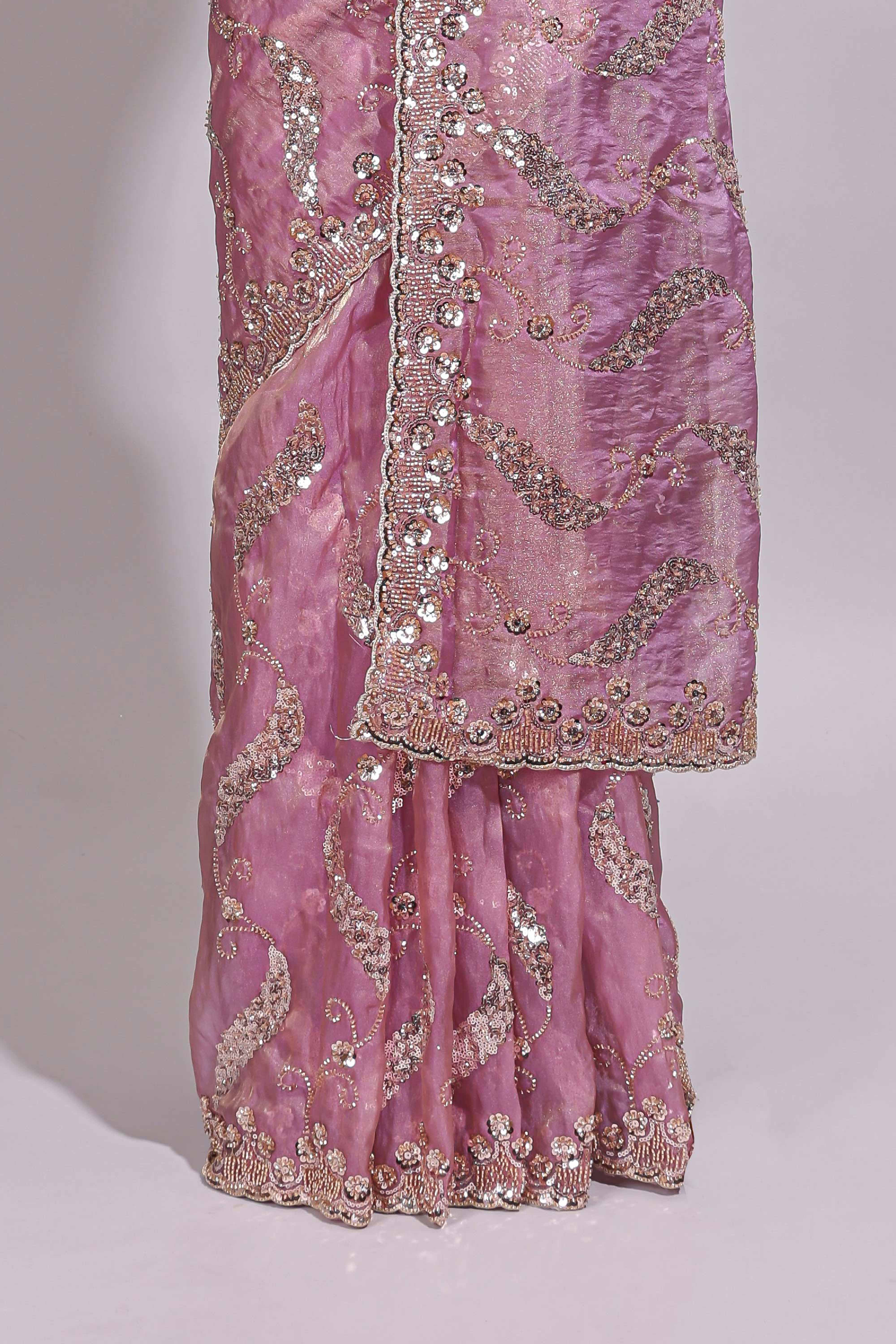 Onion pink saree with sequin abstract wave embroidery and a detailed embellished border along with matching blouse