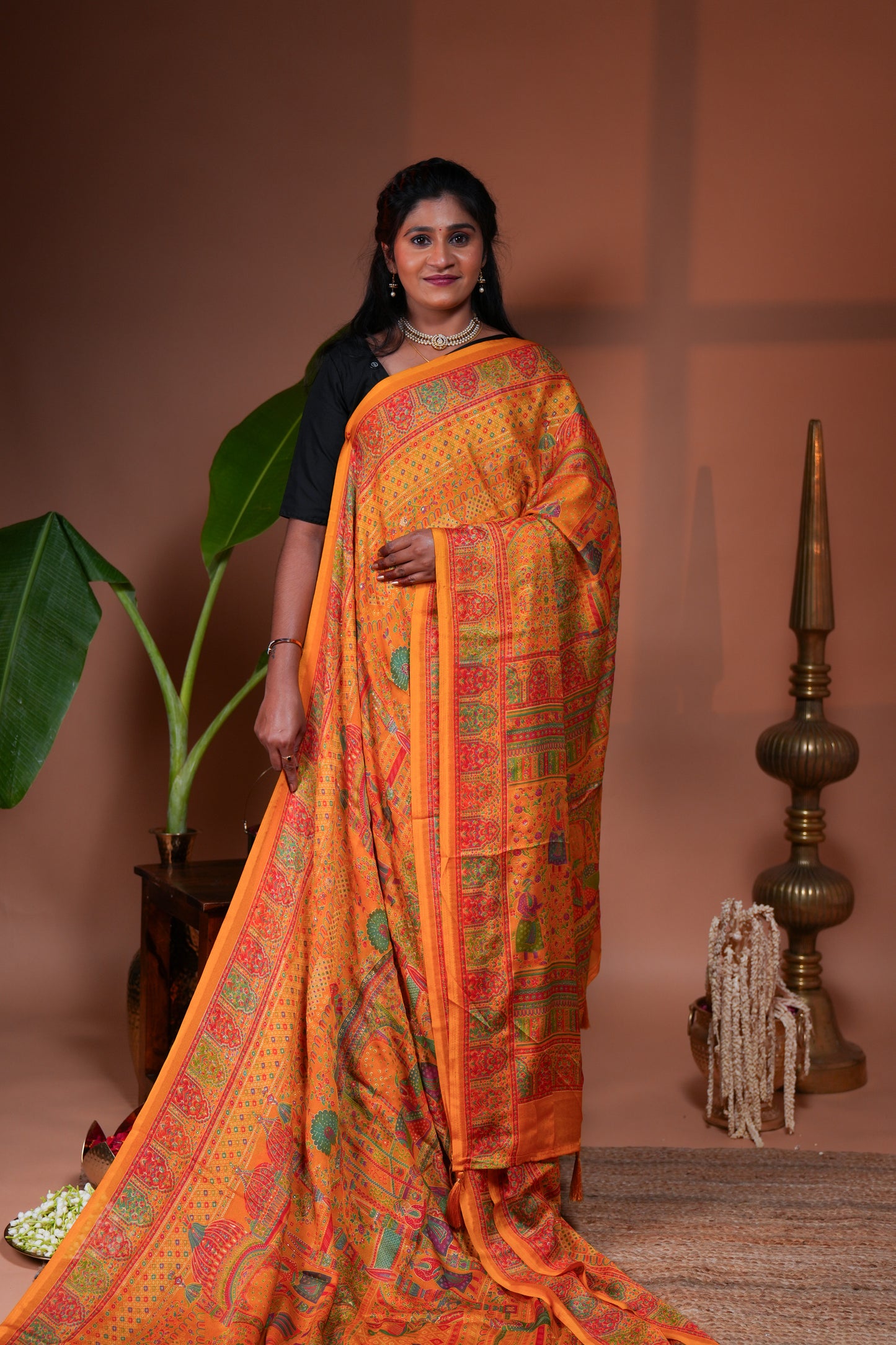 Orange mughal style foil print georgette saree with self border and matching floral printed blouse