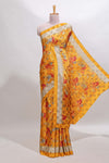 Golden yellow floral design georgette saree with contrast border and matching blouse