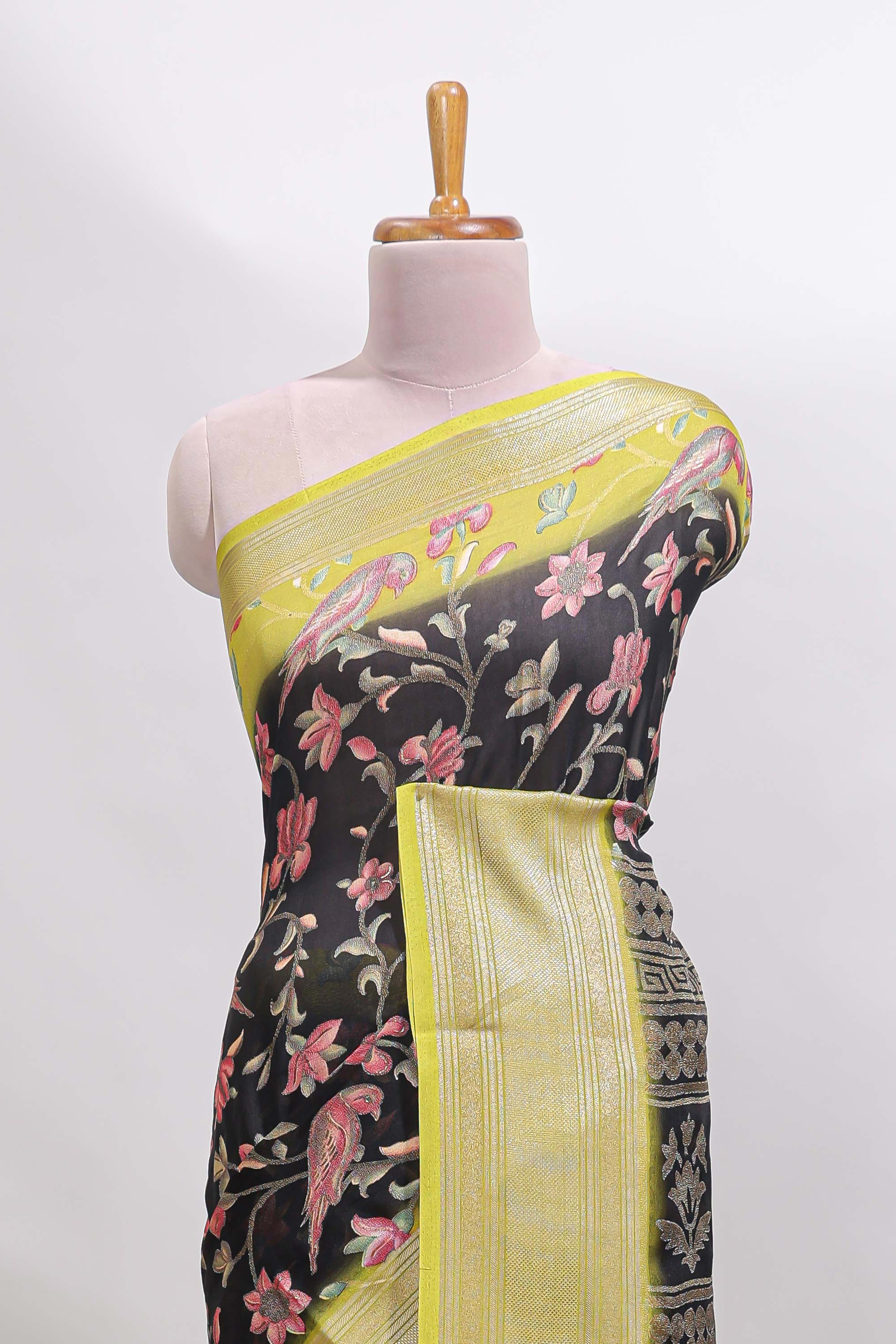 Black floral design georgette saree with contrast border and motifs blouse