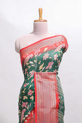 Green floral design georgette saree with contrast border and motifs blouse