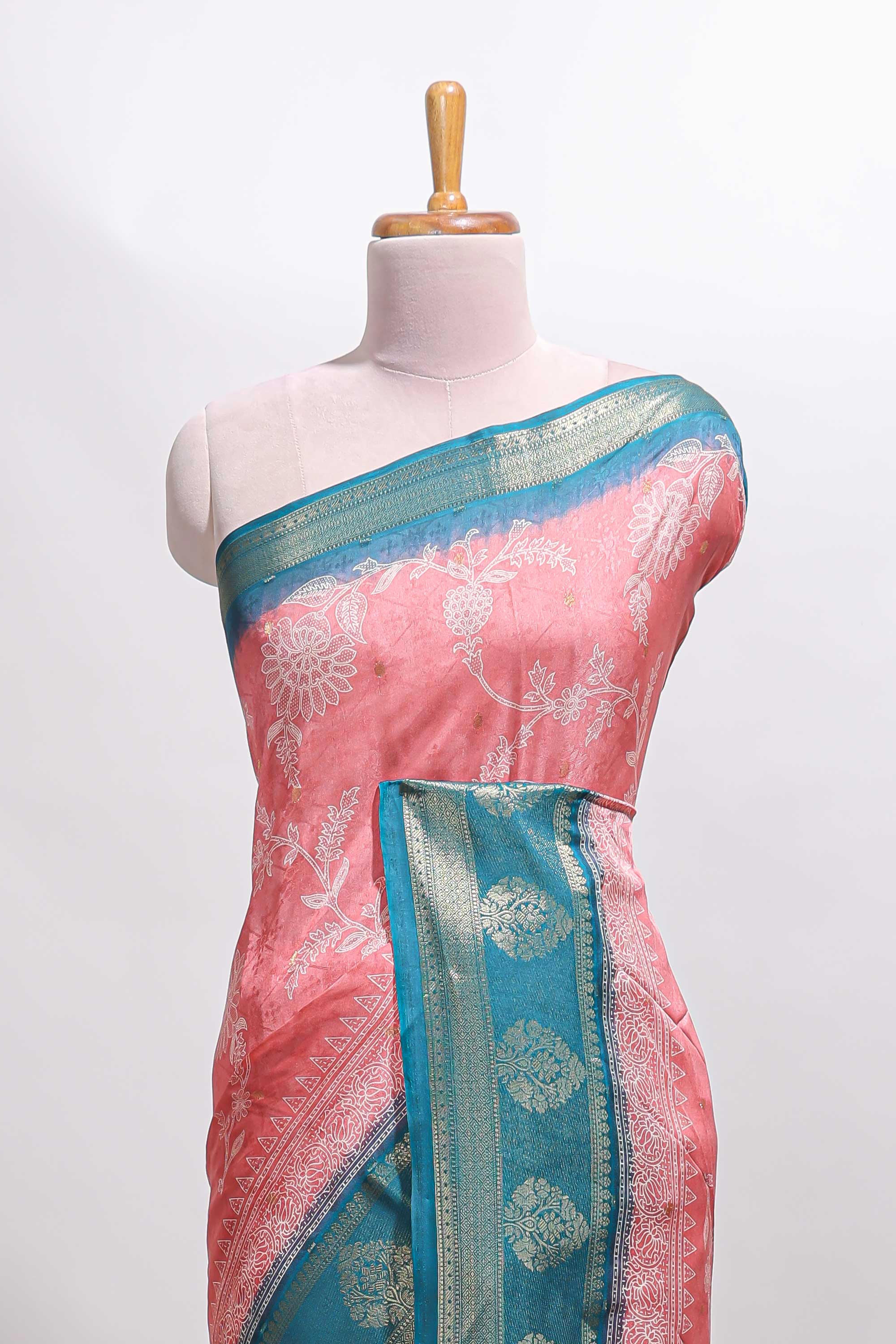 Pink floral design georgette saree with contrast border and motifs blouse