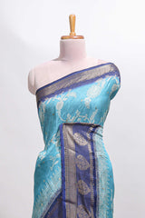 Blue floral design georgette saree with contrast border and motifs blouse