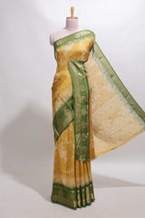Golden yellow floral design georgette saree with contrast border and motifs blouse