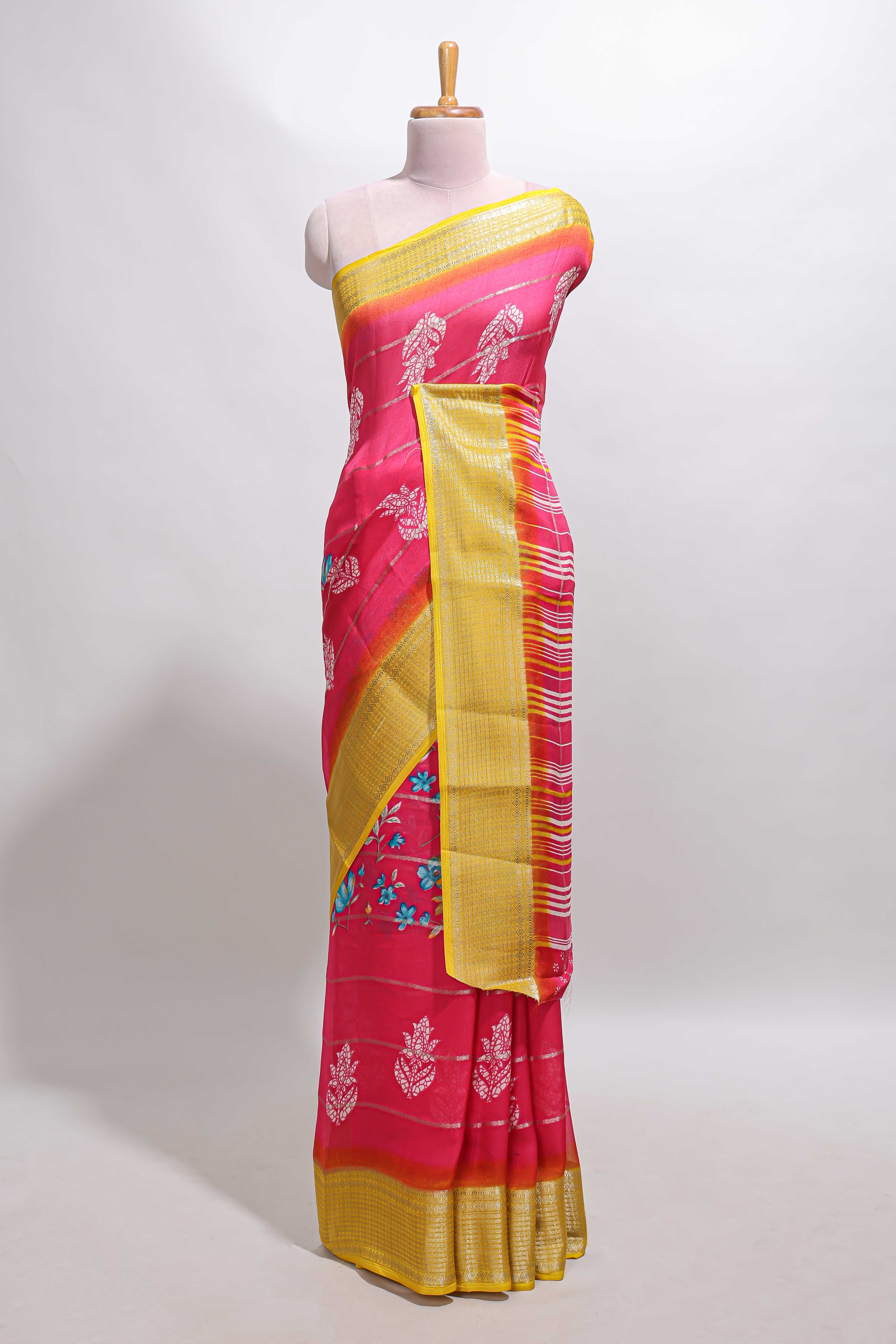 Pink striped floral design georgette saree with contrast border and motifs blouse