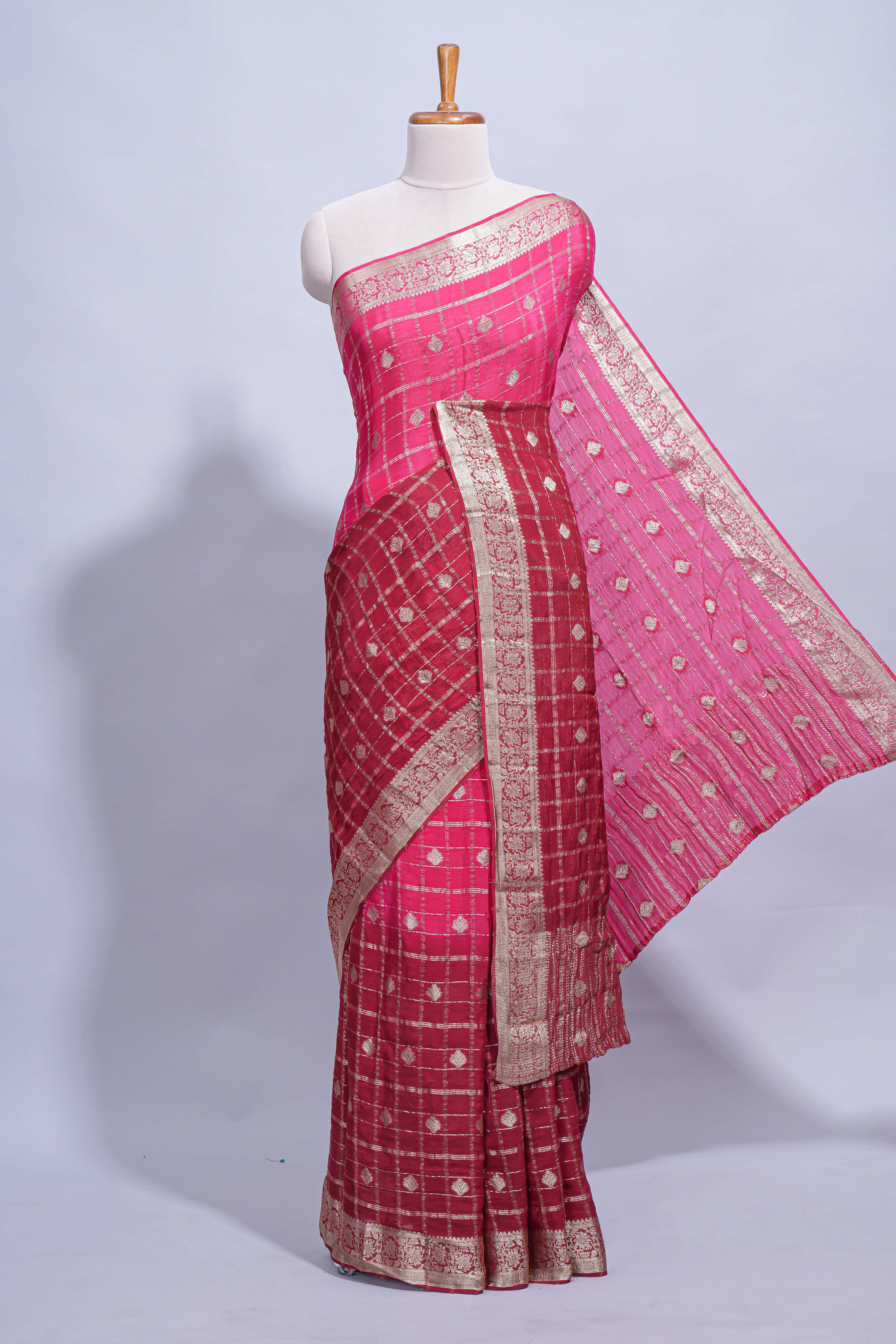 Rani pink double shaded zari checks georgette saree with small zari border and self pallu along with matching zari buttas blouse piece