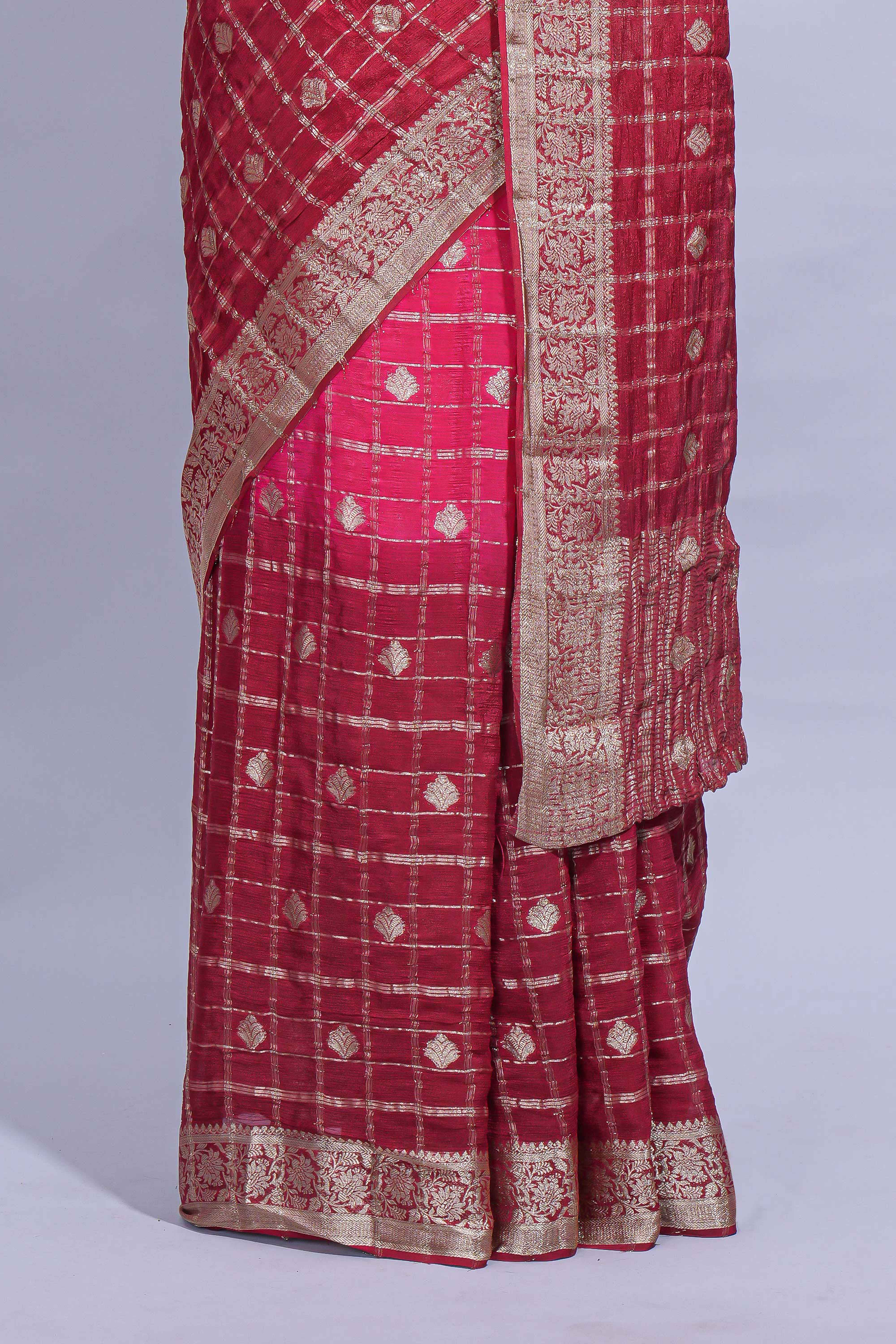 Rani pink double shaded zari checks georgette saree with small zari border and self pallu along with matching zari buttas blouse piece