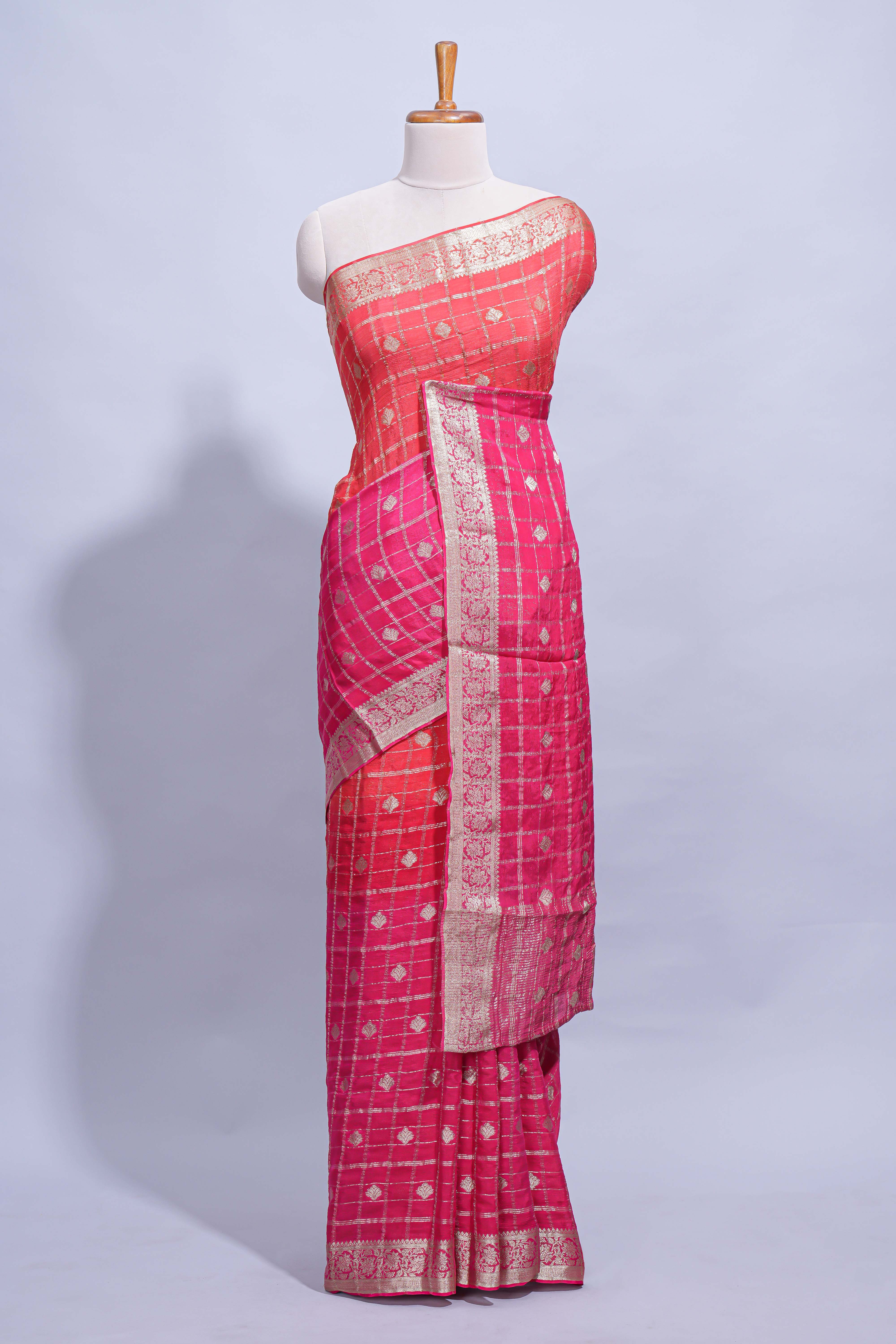 Rani Pink and orange double shaded zari checks georgette saree with small zari border and self pallu along with matching zari buttas blouse piece