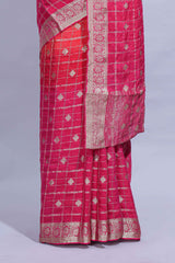 Rani Pink and orange double shaded zari checks georgette saree with small zari border and self pallu along with matching zari buttas blouse piece