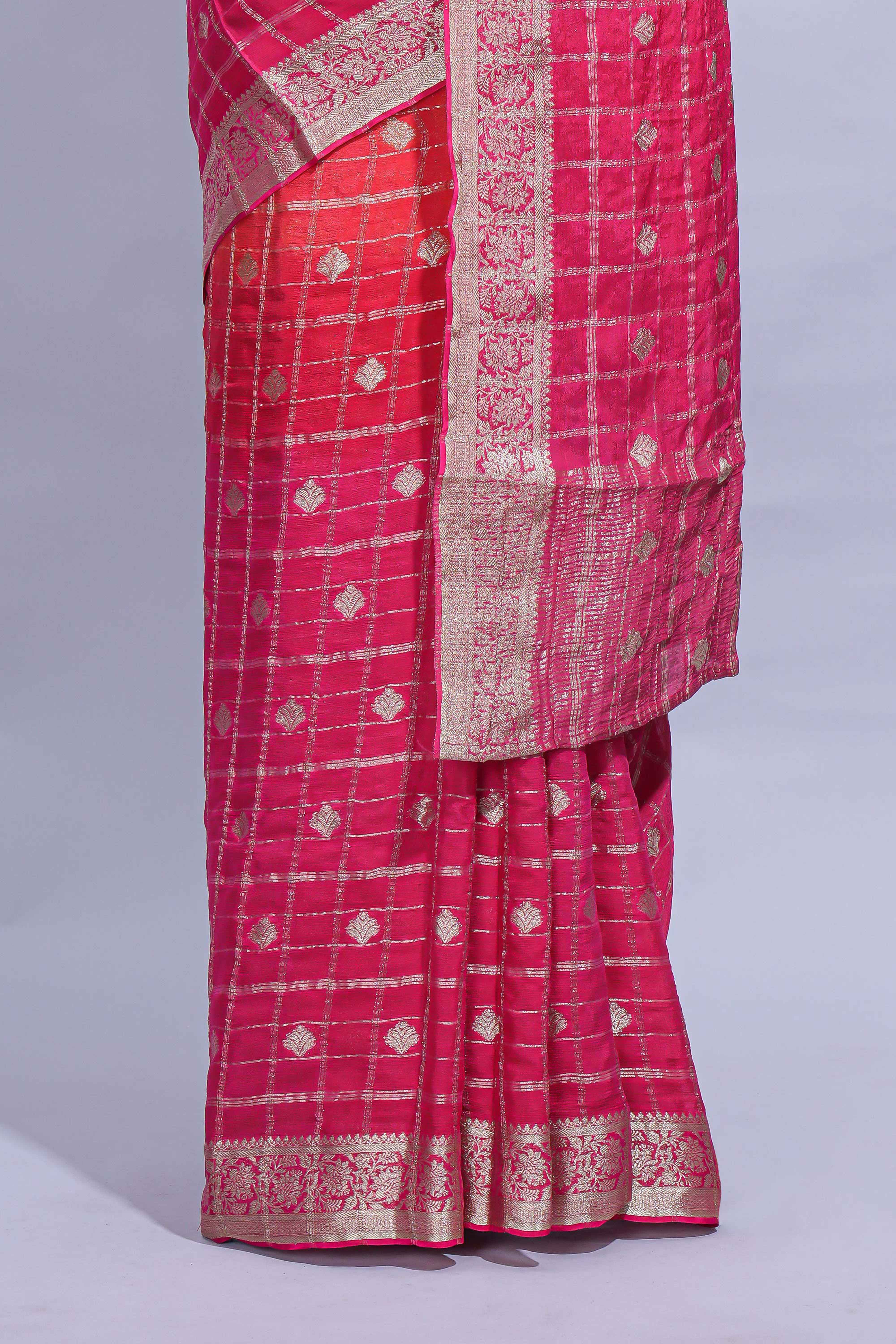Rani Pink and orange double shaded zari checks georgette saree with small zari border and self pallu along with matching zari buttas blouse piece