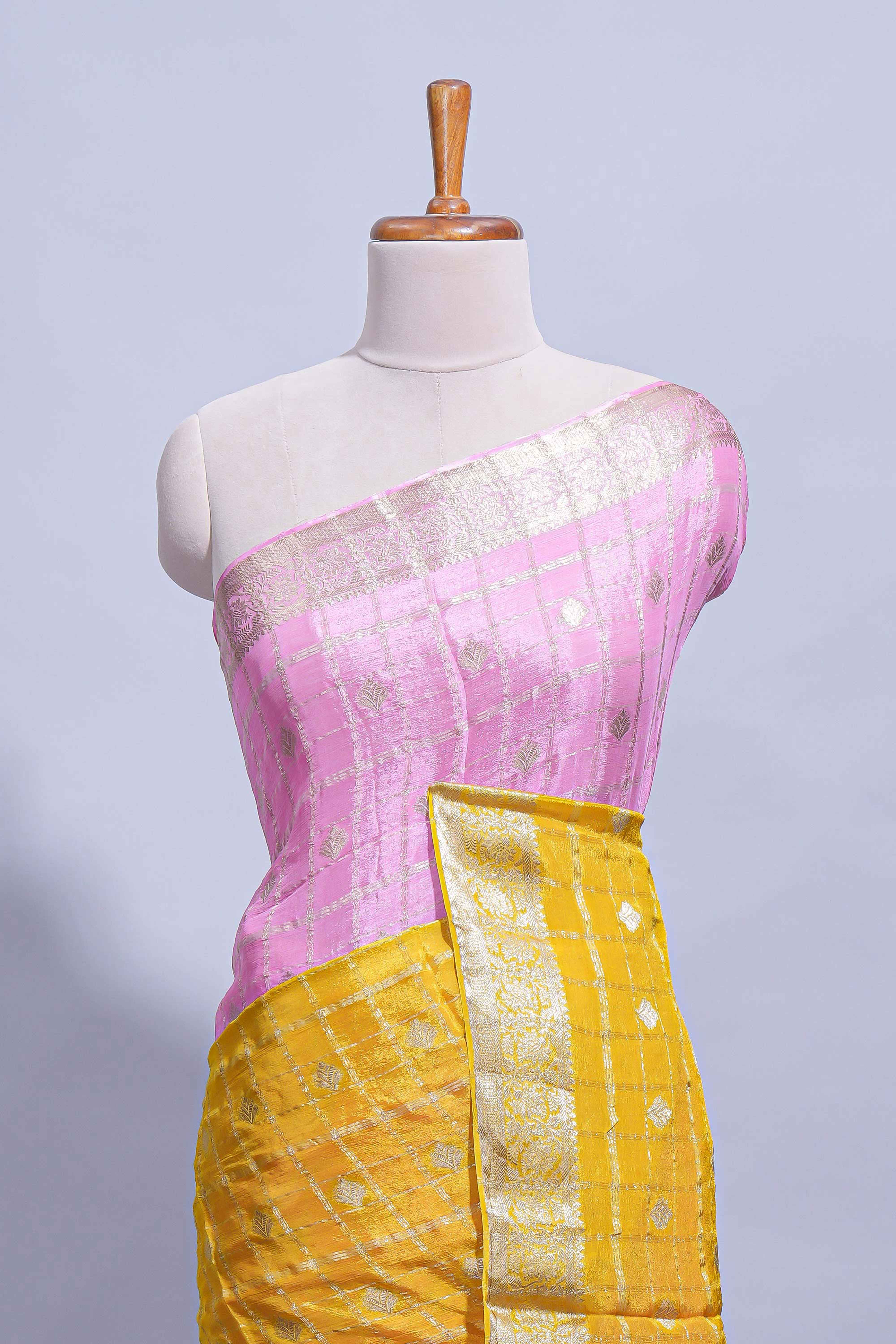 Mustard yellow and pink double shaded zari checks georgette saree with small zari border and self pallu along with matching zari buttas blouse piece