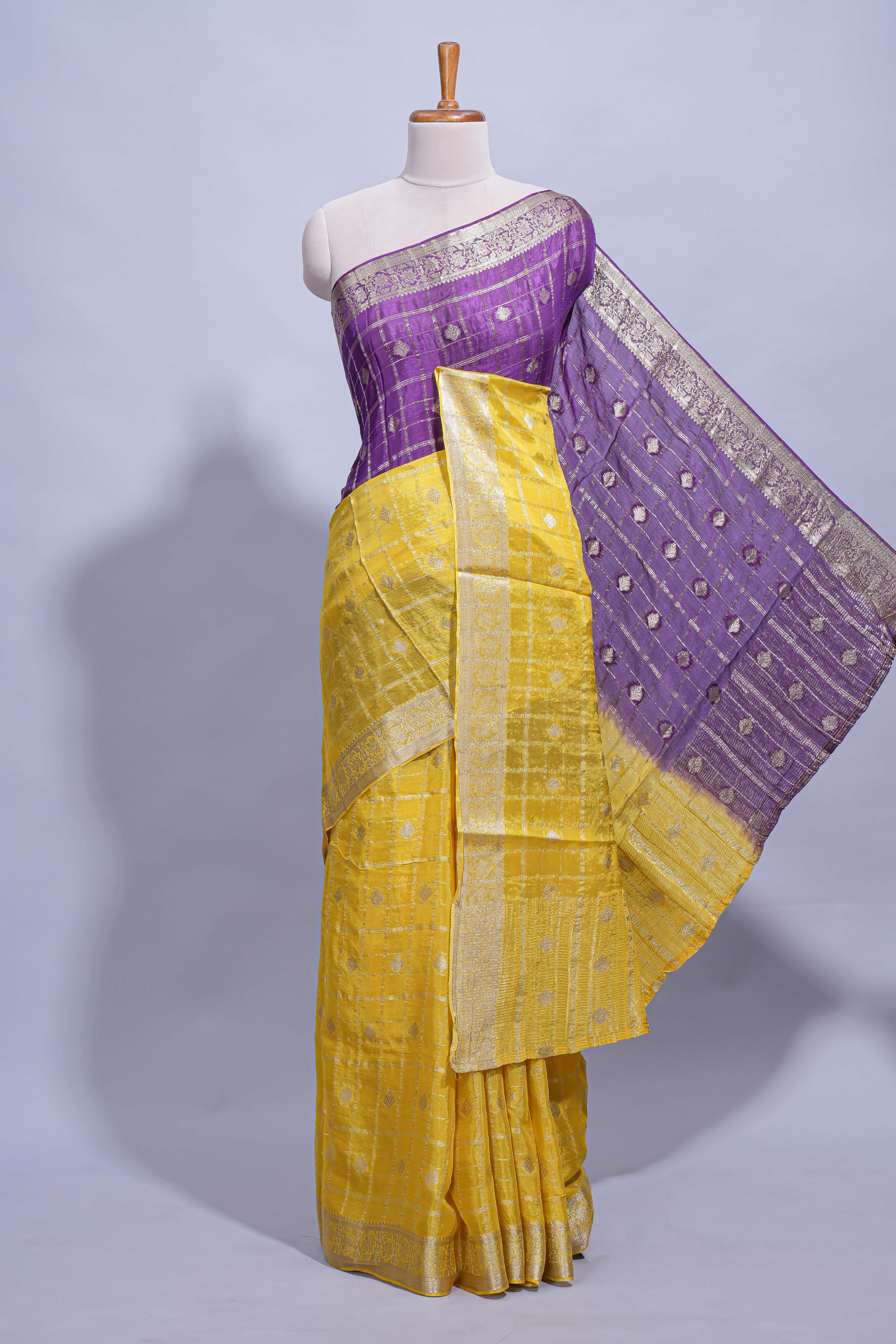 Yellow and violet double shaded zari checks georgette saree with small zari border and self pallu along with matching zari buttas blouse piece